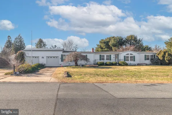 a swimming pool with buildings in the background