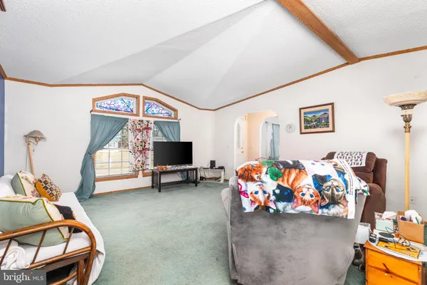a bedroom with furniture and a chair