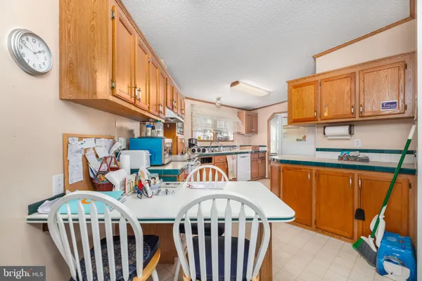 a view of a kitchen area with furniture and a window