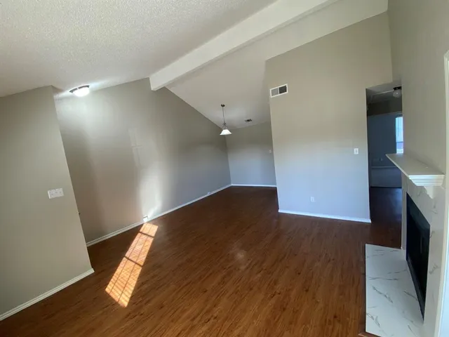 a view of a livingroom with wooden floor