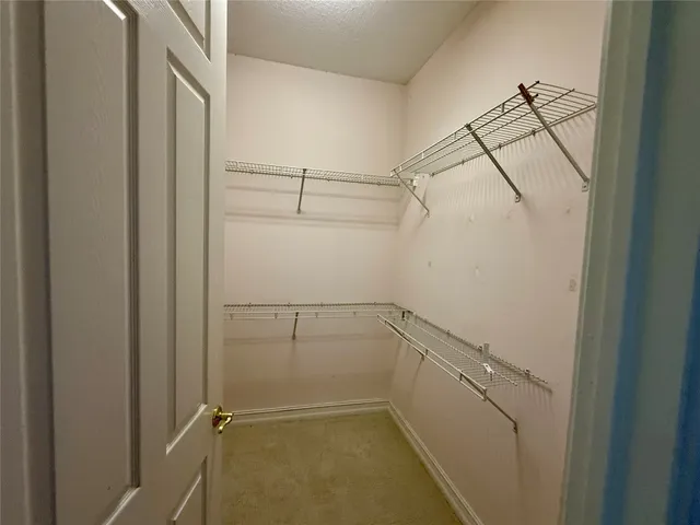 a view of a room with racks on the wall