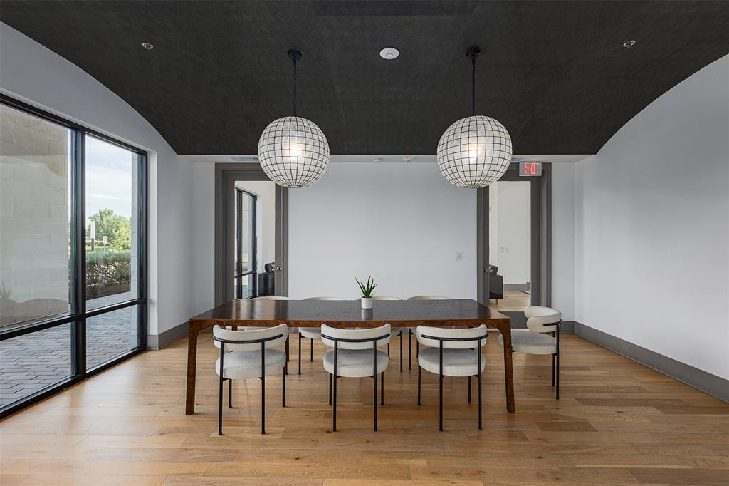 2700 Old Denton Road, Unit 1044 Carrollton, TX 75007 - Photo 25 of 33 Spacious room featuring a dark vaulted ceiling and light wood-finish flooring