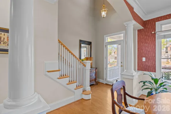 a view of a hallway with furniture and entryway