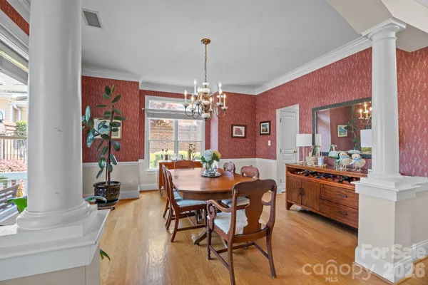 a dining room with furniture and window