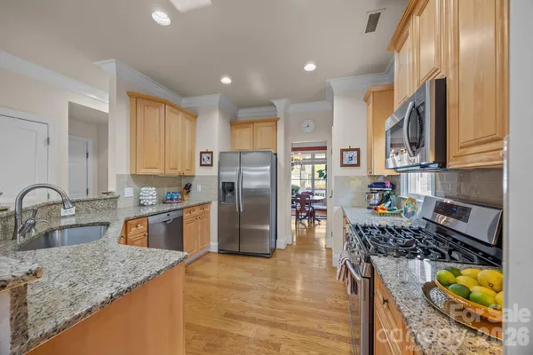 a kitchen with refrigerator and stove