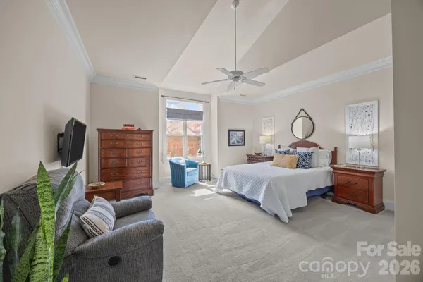 a bed room with furniture and a chandelier