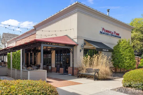 a view of a cafe with sitting area