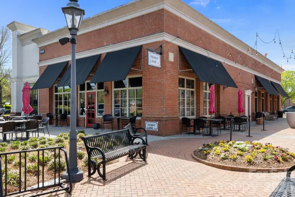 a view of a chairs and table in the patio