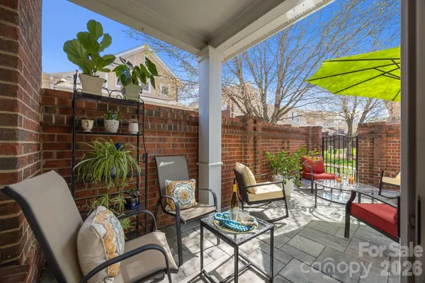 a view of a chairs and table in patio