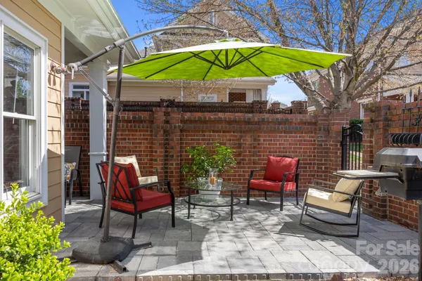a view of a chairs and table in the patio