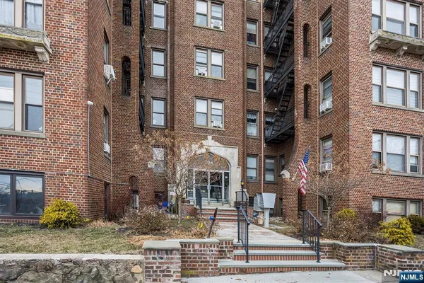a front view of a multi story residential apartment building