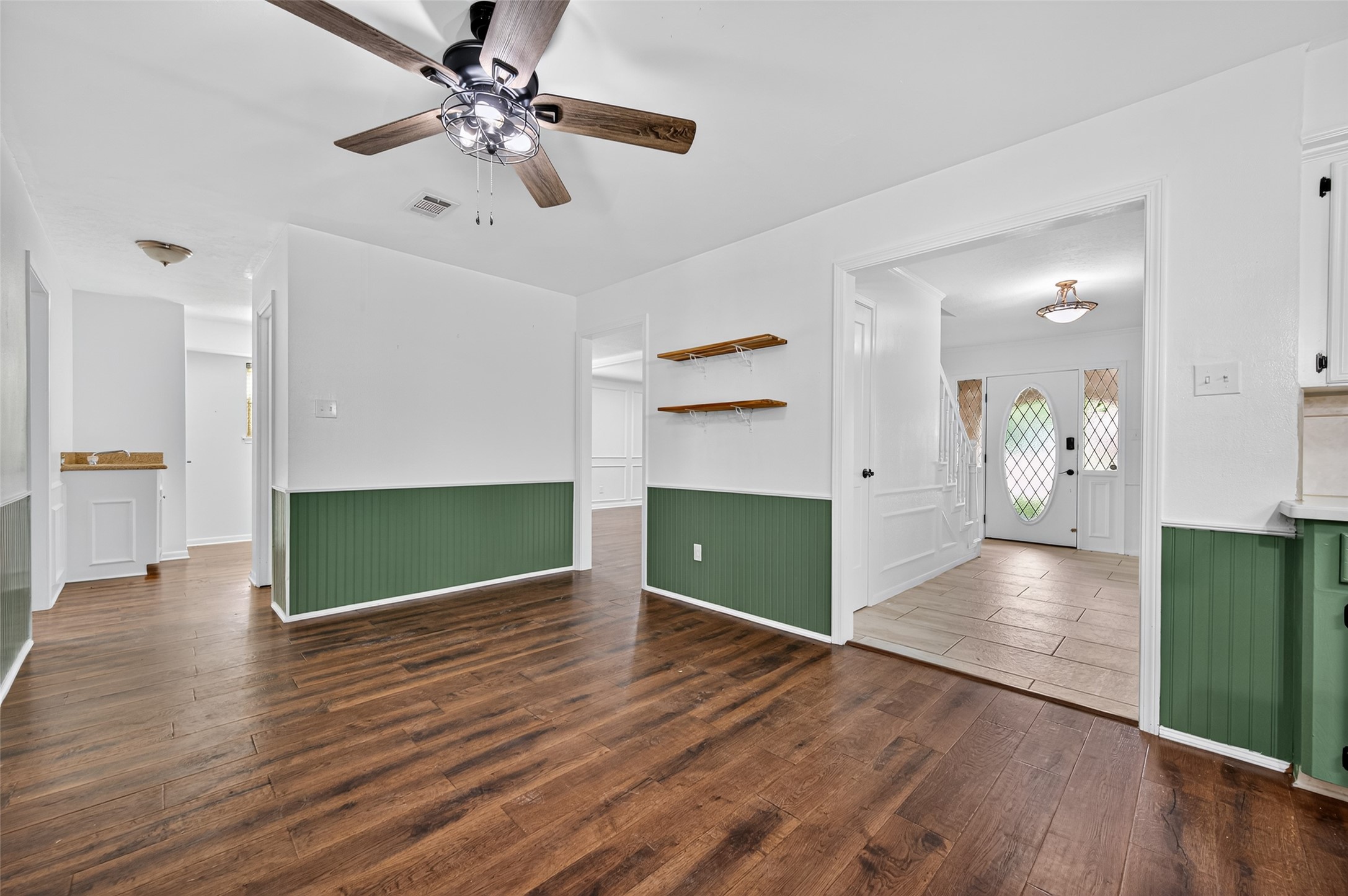 202 Laura Lane Conroe, TX 77385 - Photo 11 of 31 a view of empty room with wooden floor