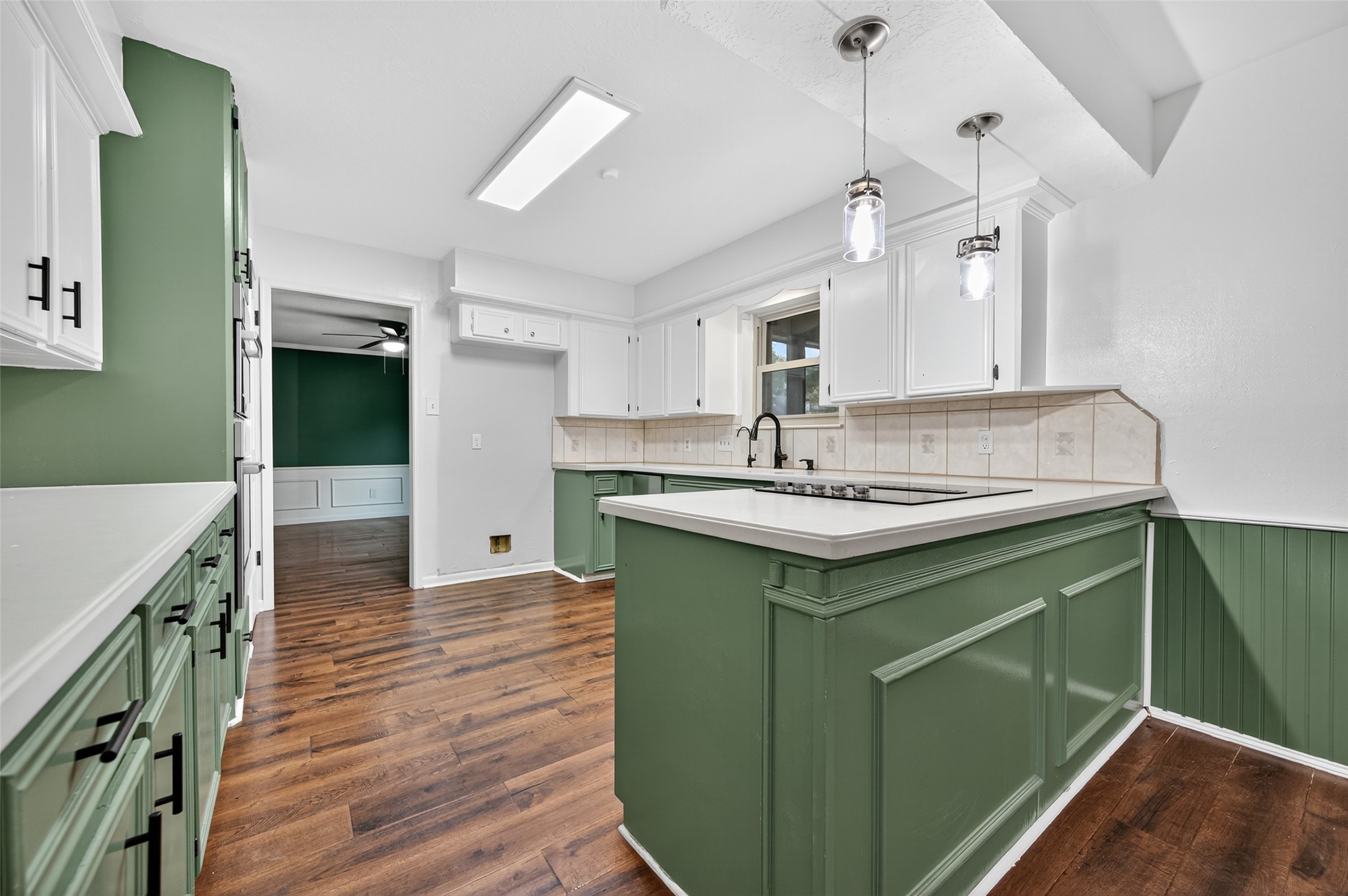 202 Laura Lane Conroe, TX 77385 - Photo 12 of 31 a kitchen with a sink cabinets and wooden floor