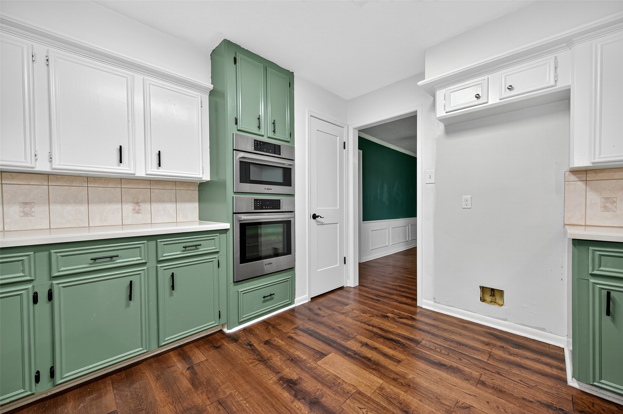 202 Laura Lane Conroe, TX 77385 - Photo 17 of 31 a kitchen with stainless steel appliances cabinets and wooden floor