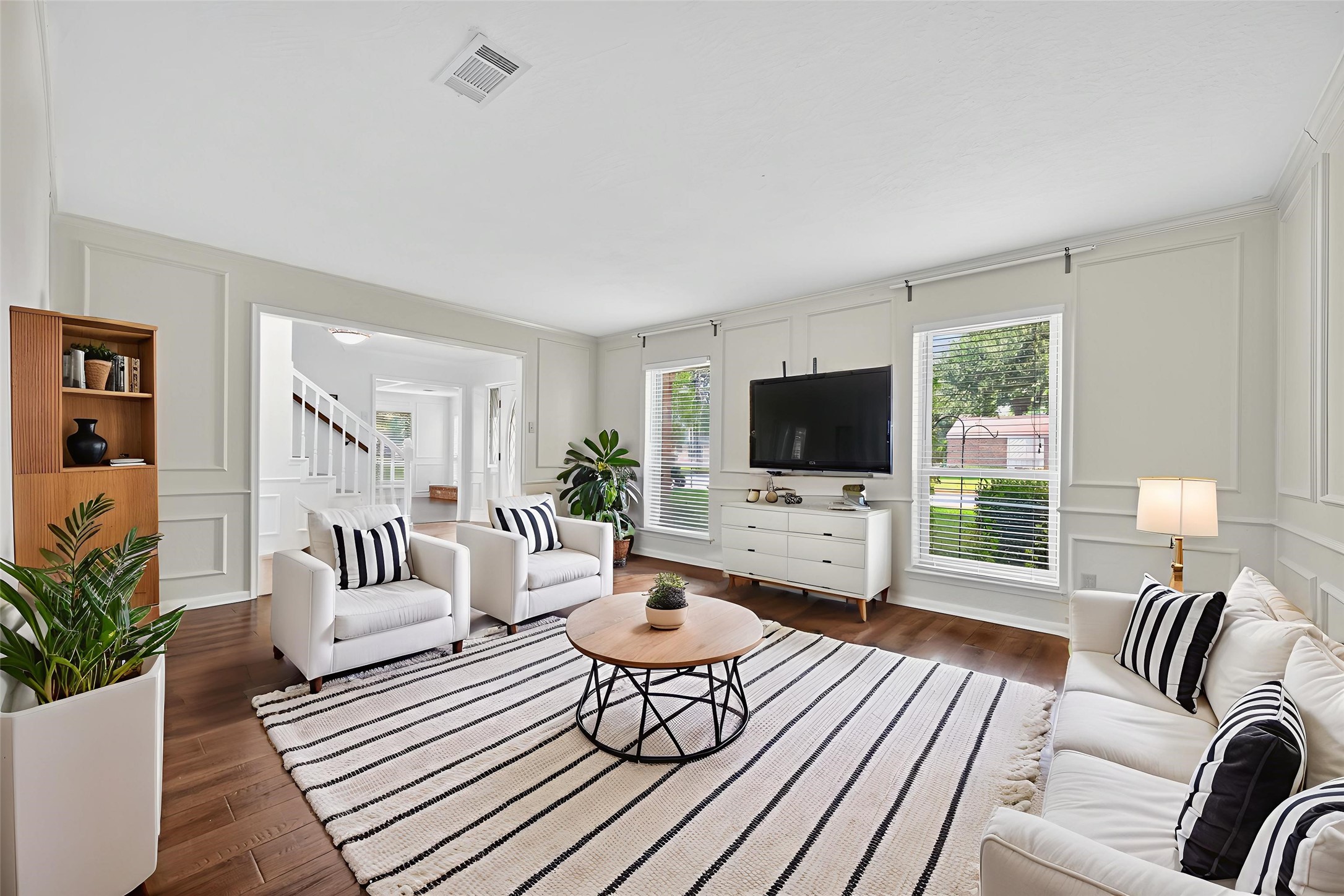 202 Laura Lane Conroe, TX 77385 - Photo 19 of 31 a living room with furniture fireplace and a flat screen tv