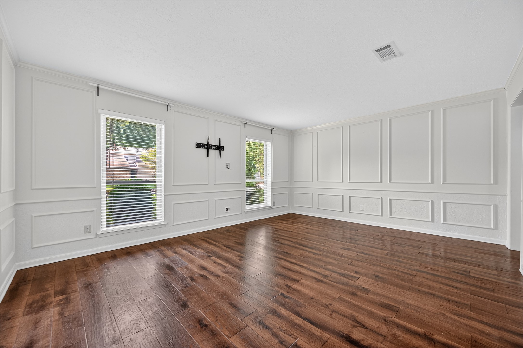 202 Laura Lane Conroe, TX 77385 - Photo 20 of 31 a view of empty room with wooden floor and fan