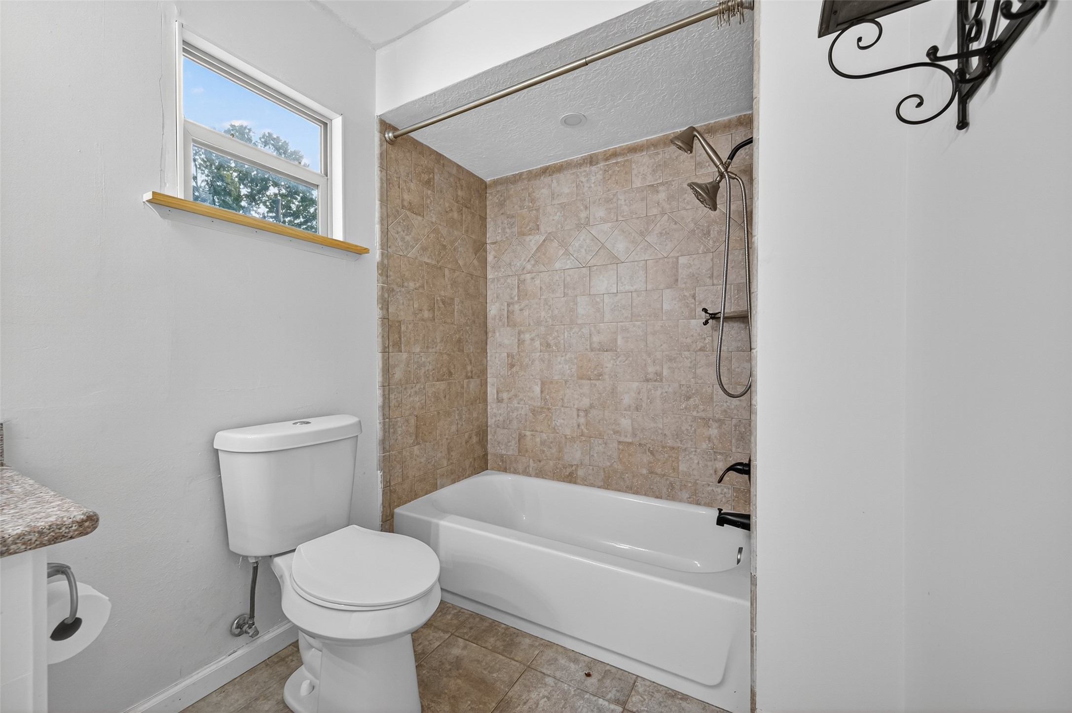 202 Laura Lane Conroe, TX 77385 - Photo 23 of 31 a bathroom with a toilet and a shower
