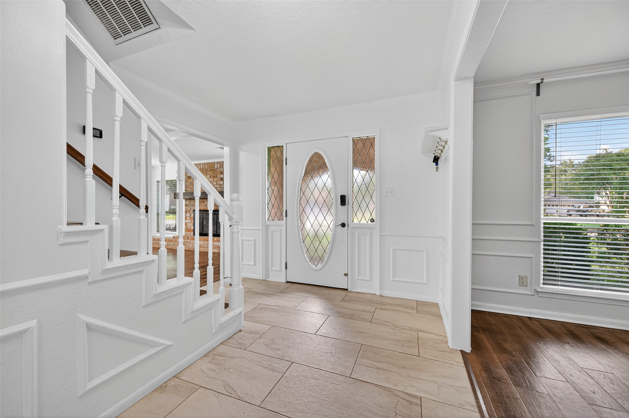202 Laura Lane Conroe, TX 77385 - Photo 3 of 31 a view of an entryway with stairs
