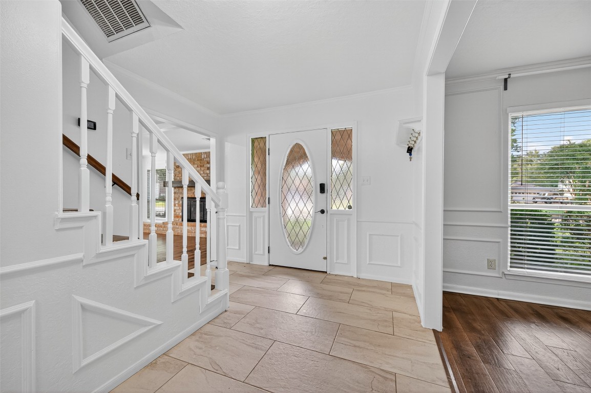 202 Laura Lane Conroe, TX 77385 - Photo 3 of 31 a view of an entryway with stairs
