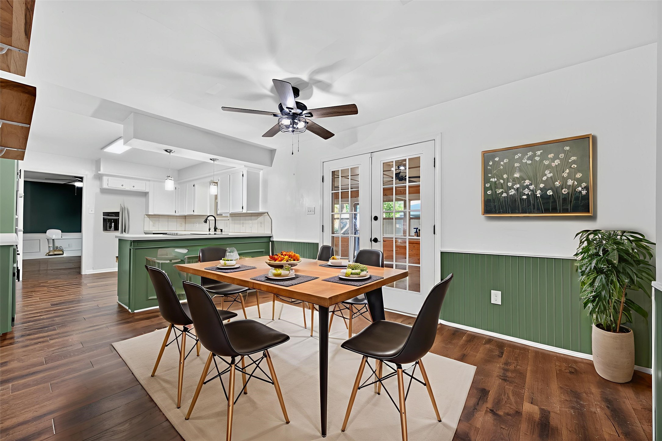 202 Laura Lane Conroe, TX 77385 - Photo 7 of 31 a view of a dining room with furniture and wooden floor