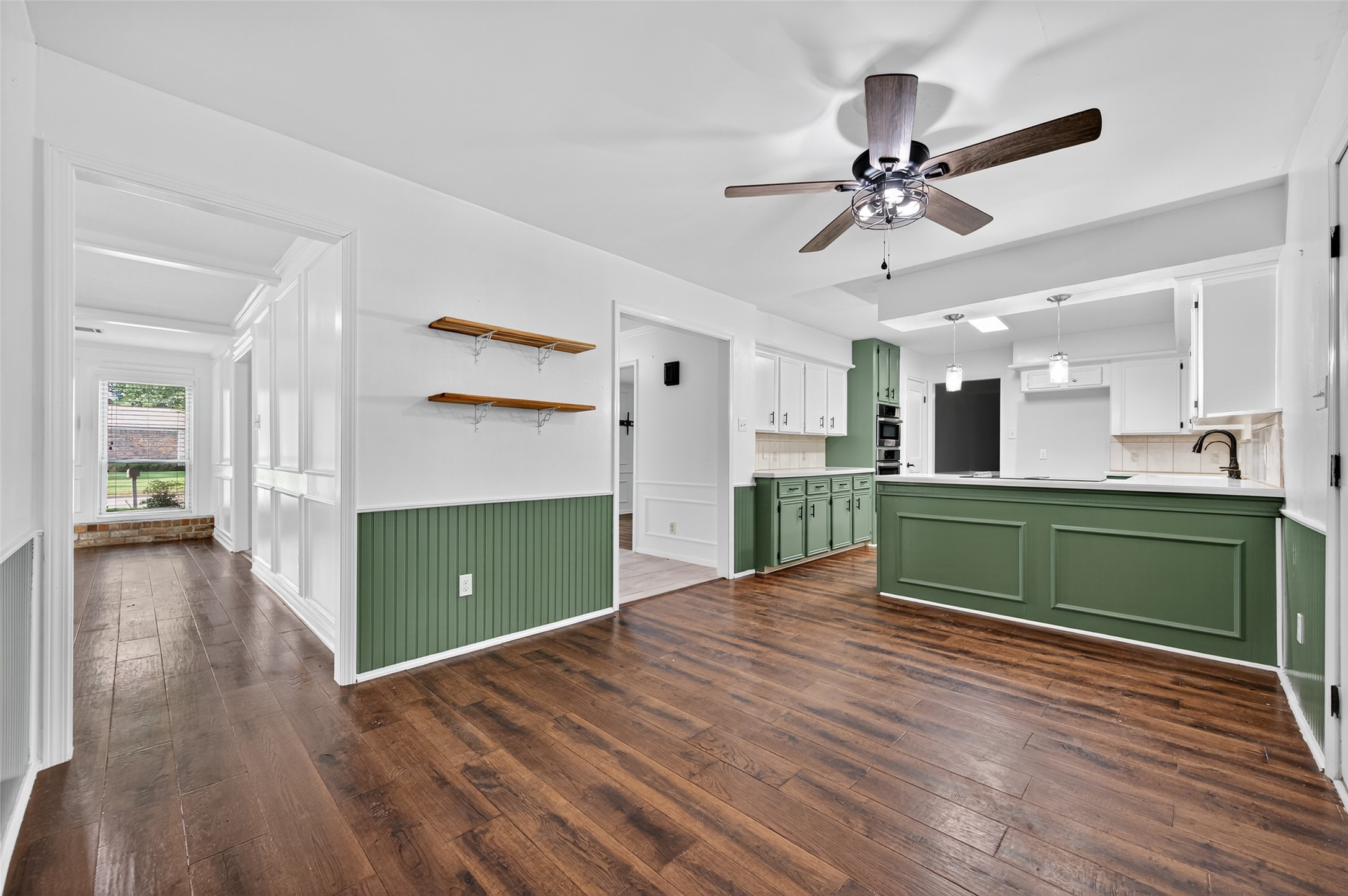 202 Laura Lane Conroe, TX 77385 - Photo 8 of 31 a view interior of kitchen and hall with wooden floor