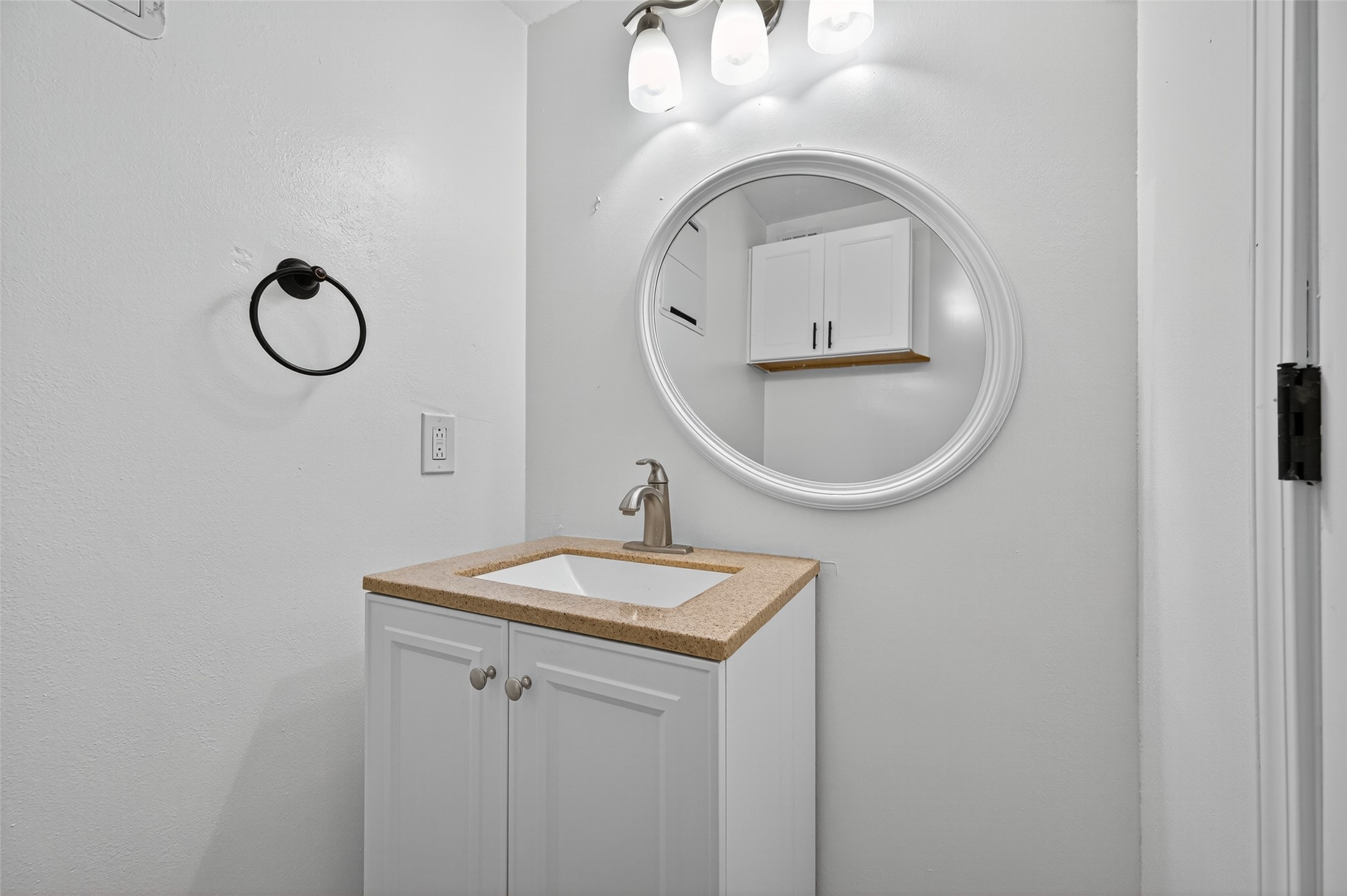 202 Laura Lane Conroe, TX 77385 - Photo 9 of 31 a bathroom with a sink and a mirror