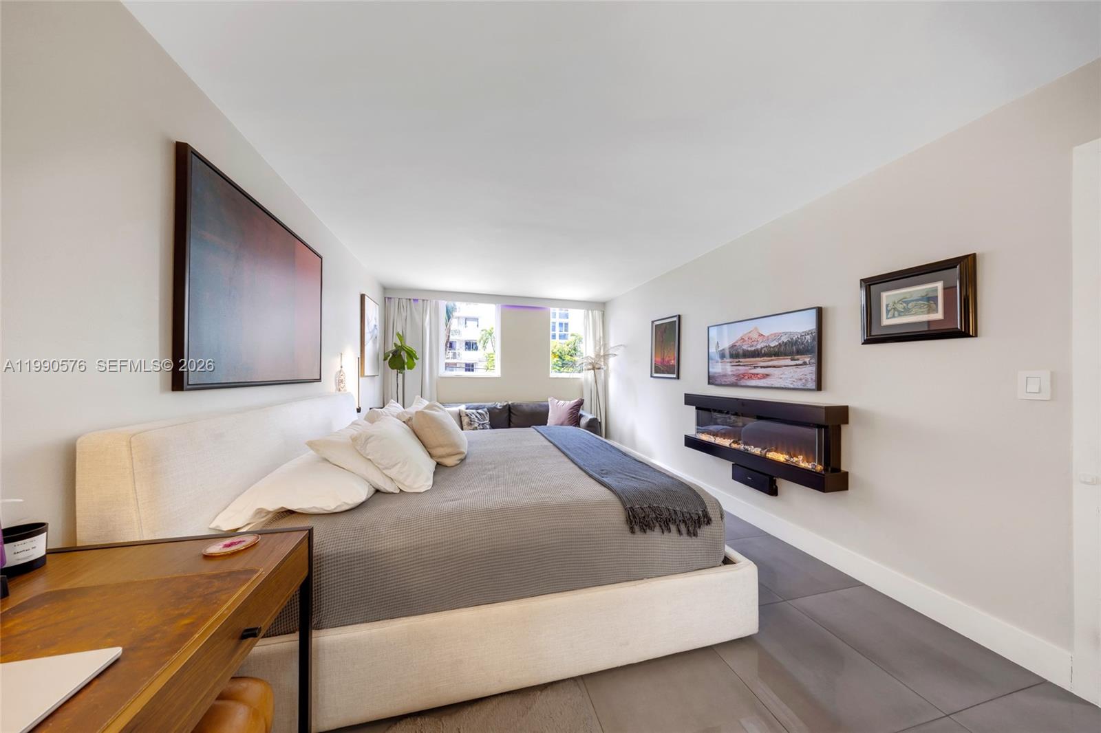 1665 Bay Road, Unit 221 Miami Beach, FL 33139 - Photo 20 of 33 a bedroom with a bed and dresser