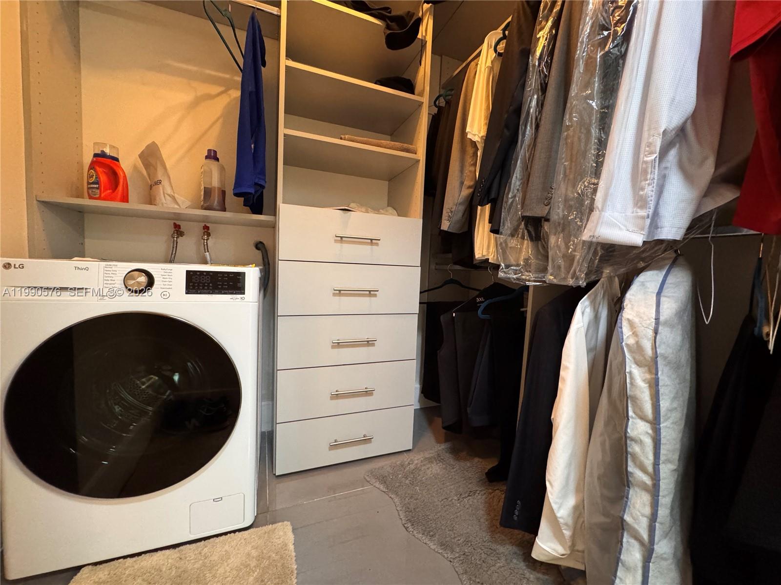 1665 Bay Road, Unit 221 Miami Beach, FL 33139 - Photo 2 of 33 a view of walk in closet with clothes and shoes