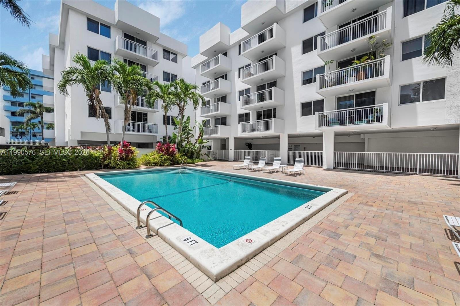 1665 Bay Road, Unit 221 Miami Beach, FL 33139 - Photo 27 of 33 a view of a building with a swimming pool
