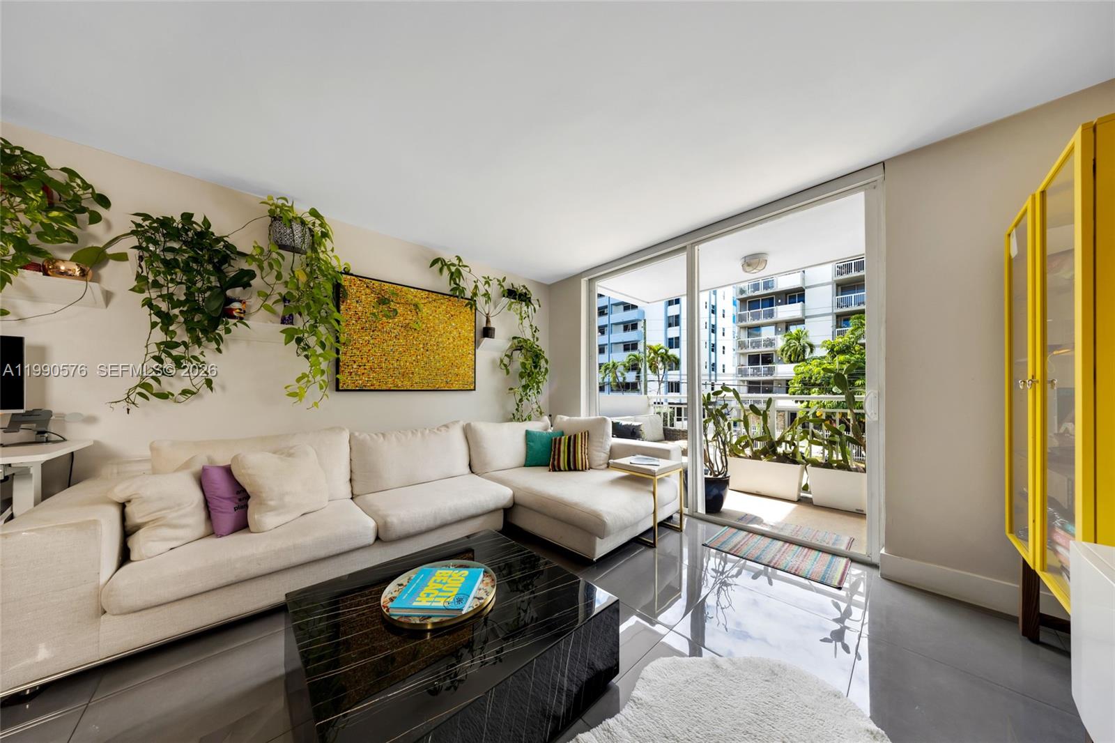 1665 Bay Road, Unit 221 Miami Beach, FL 33139 - Photo 5 of 33 a living room with furniture and a large window