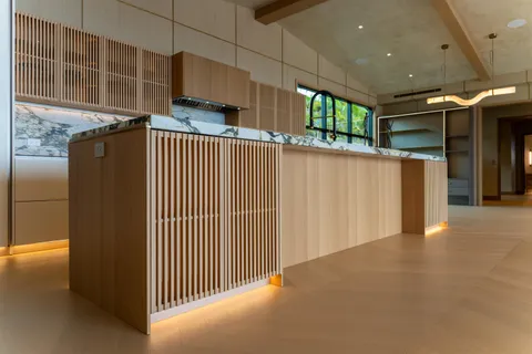 a table with chairs and a wooden floor