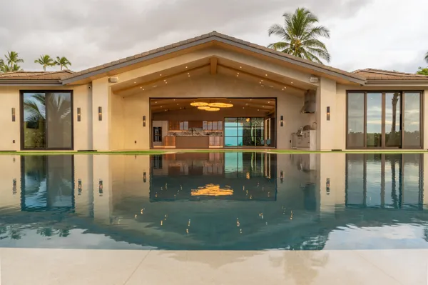 a table with chairs and a wooden floor