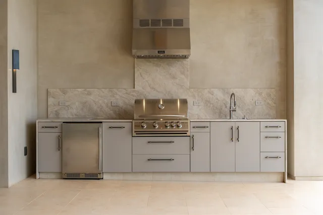 a spacious bathroom with a granite countertop sink and a mirror