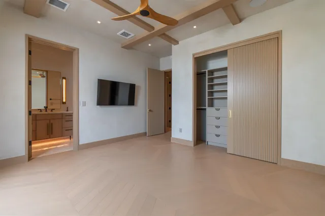 a bathroom with a glass shower door