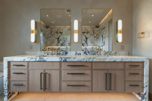 a view of a kitchen with a sink and cabinets