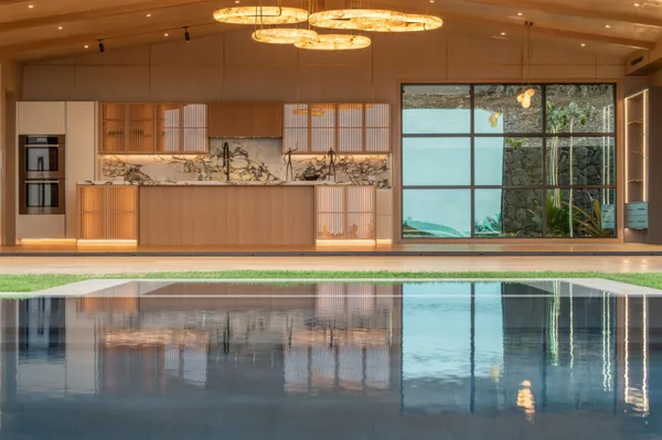 a view of swimming pool with a table and chairs