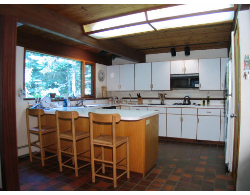 39 Westbrook Lane Westwood, MA 02090 - Photo 5 of 7 a kitchen with stainless steel appliances kitchen island granite countertop a sink and cabinets