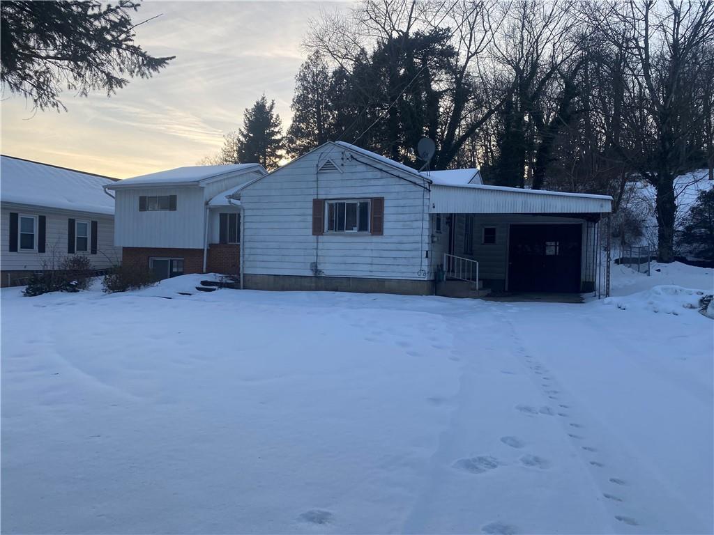 193 Highway 68 Rochester, PA 15074 - Photo 1 of 18 a view of a house with a yard covered in snow