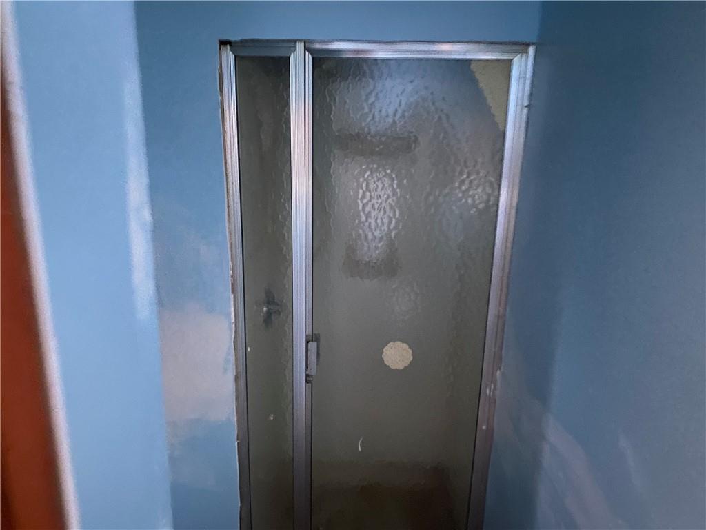 193 Highway 68 Rochester, PA 15074 - Photo 14 of 18 a bathroom with a glass shower door