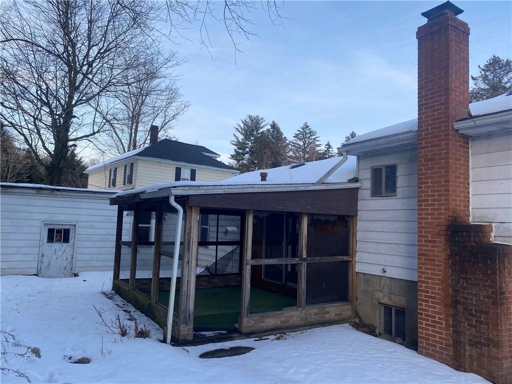 193 Highway 68 Rochester, PA 15074 - Photo 3 of 18 a view of a house with a large window and wooden fence
