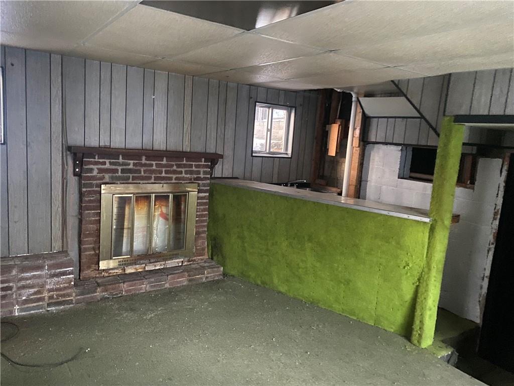 193 Highway 68 Rochester, PA 15074 - Photo 10 of 18 a living room with a fireplace windows and a kitchen view