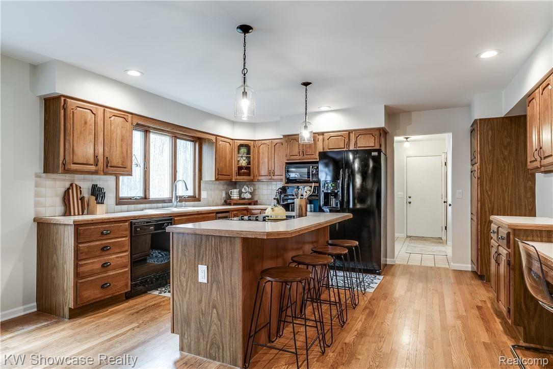 1422 North Hacker Road Howell, MI 48843 - Photo 20 of 44 Beautiful Hardwood Floors are throughout most of the entry level.