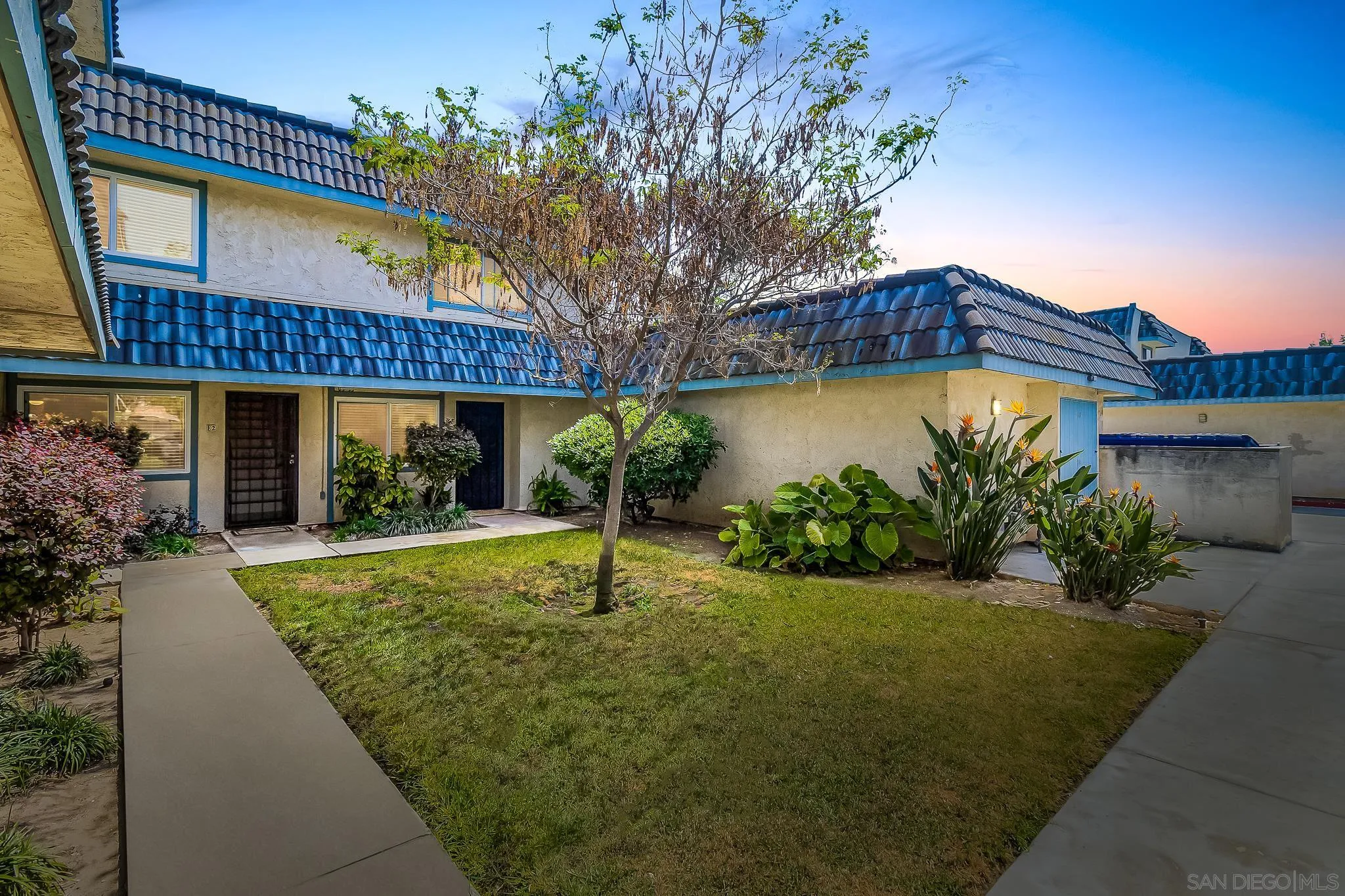 a house with garden in front of it