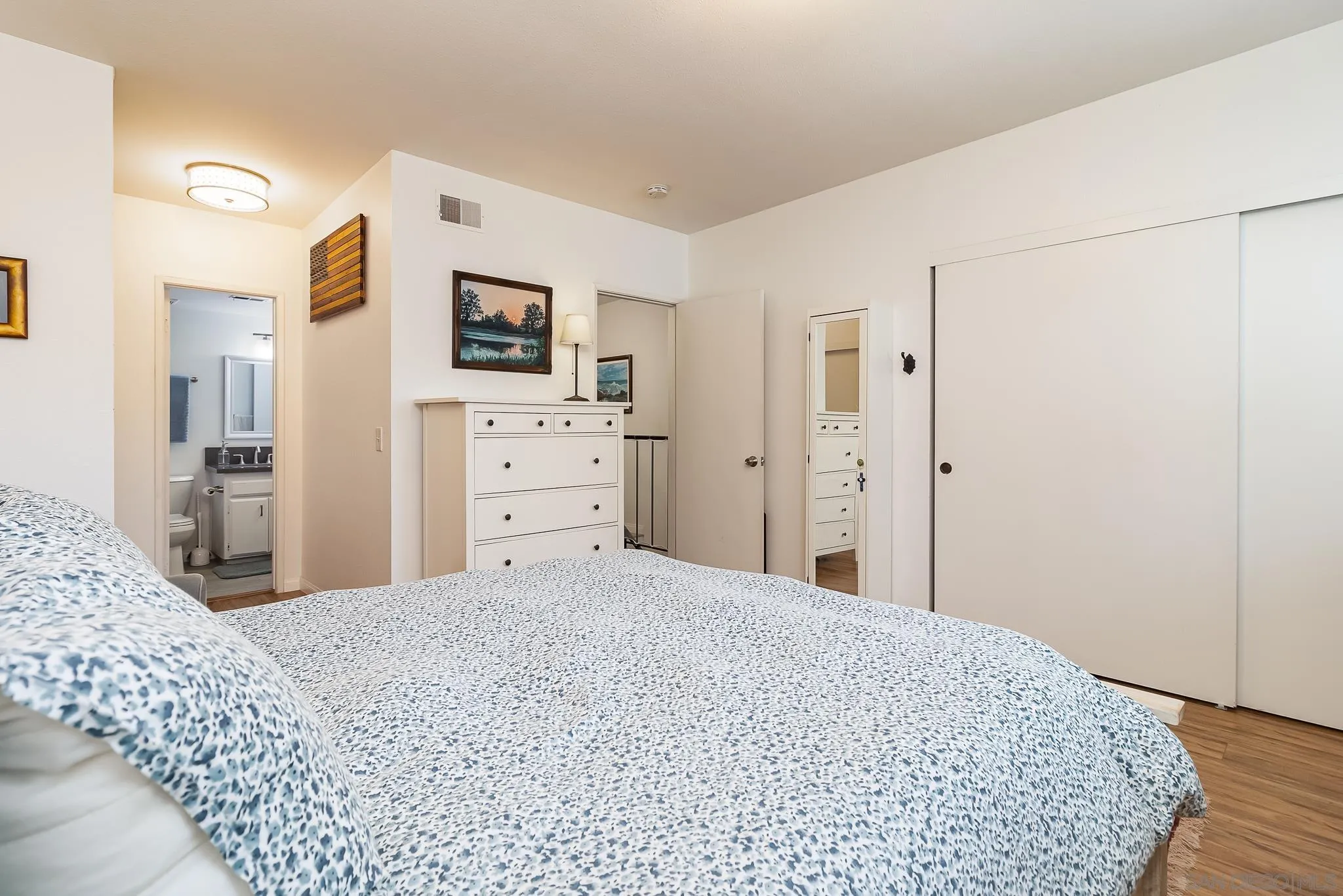 350 G Street, Unit E2 Chula Vista, CA 91910 - Photo 11 of 30 a bedroom with a bed and a dresser