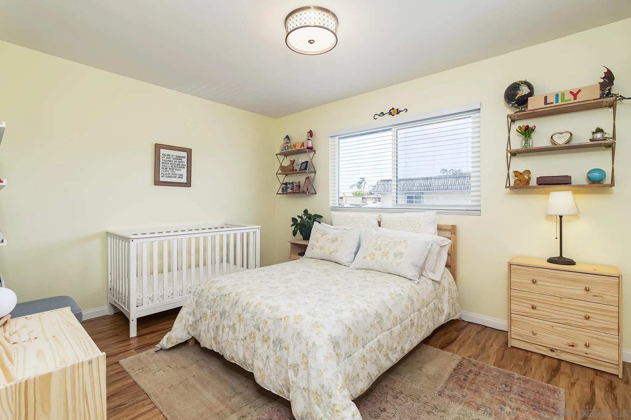 350 G Street, Unit E2 Chula Vista, CA 91910 - Photo 13 of 30 a bedroom with a bed and a window