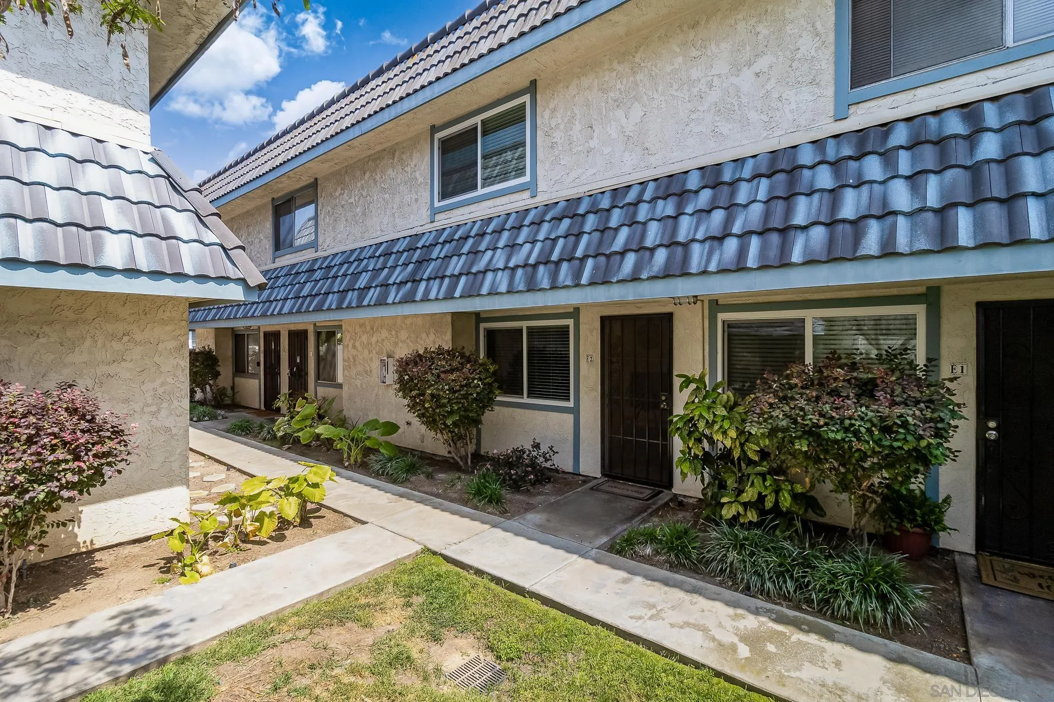 350 G Street, Unit E2 Chula Vista, CA 91910 - Photo 16 of 30 a front view of a house with garden