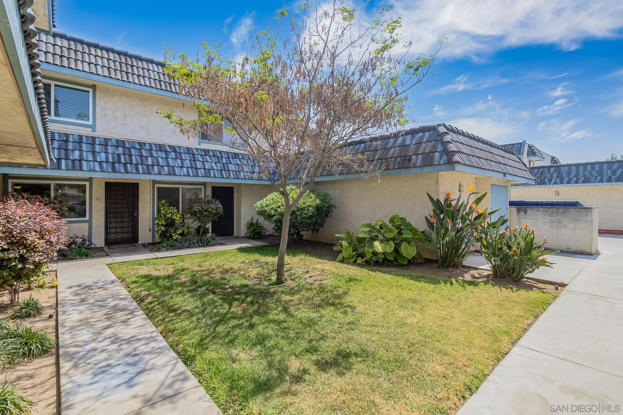 350 G Street, Unit E2 Chula Vista, CA 91910 - Photo 18 of 30 a front view of a house with garden
