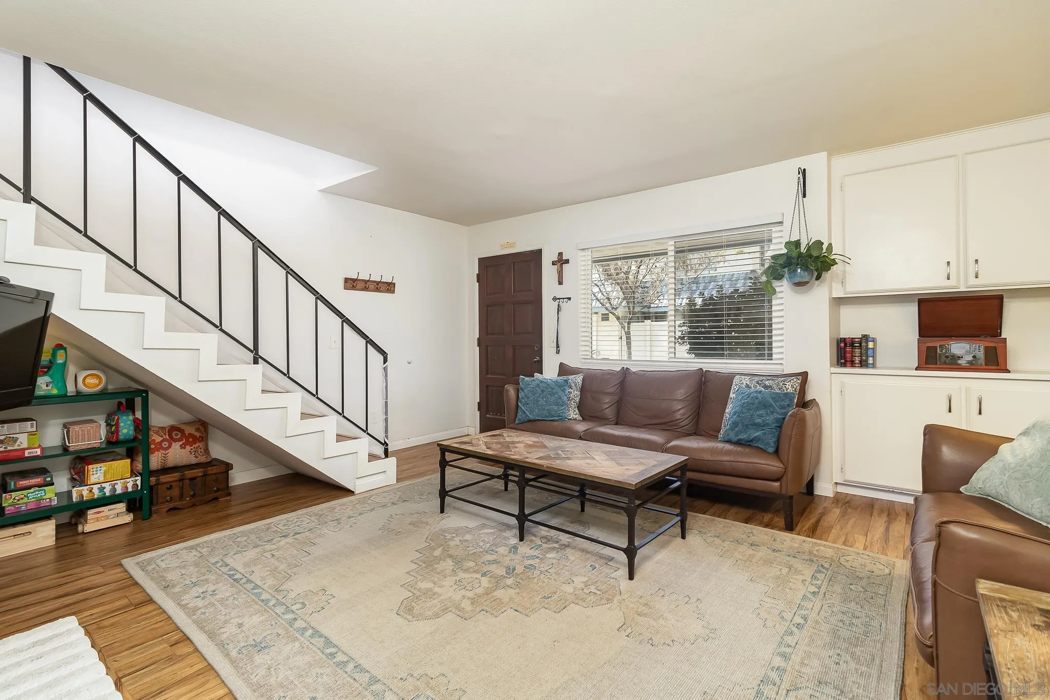 350 G Street, Unit E2 Chula Vista, CA 91910 - Photo 2 of 30 a living room with furniture and a dining table