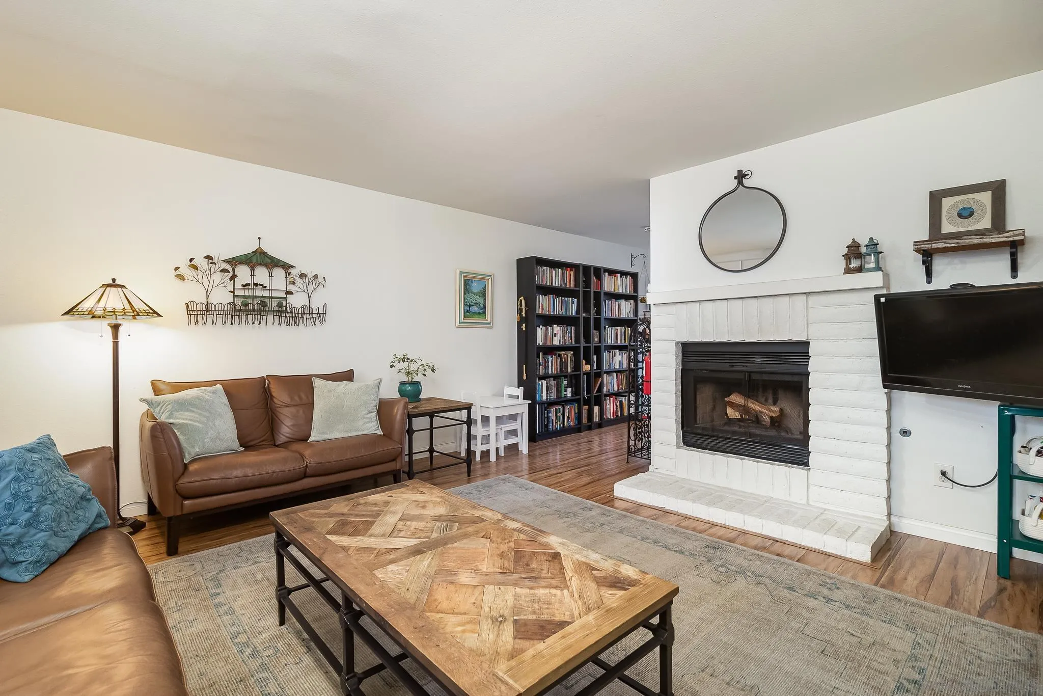 350 G Street, Unit E2 Chula Vista, CA 91910 - Photo 4 of 30 a living room with furniture a rug and a fireplace