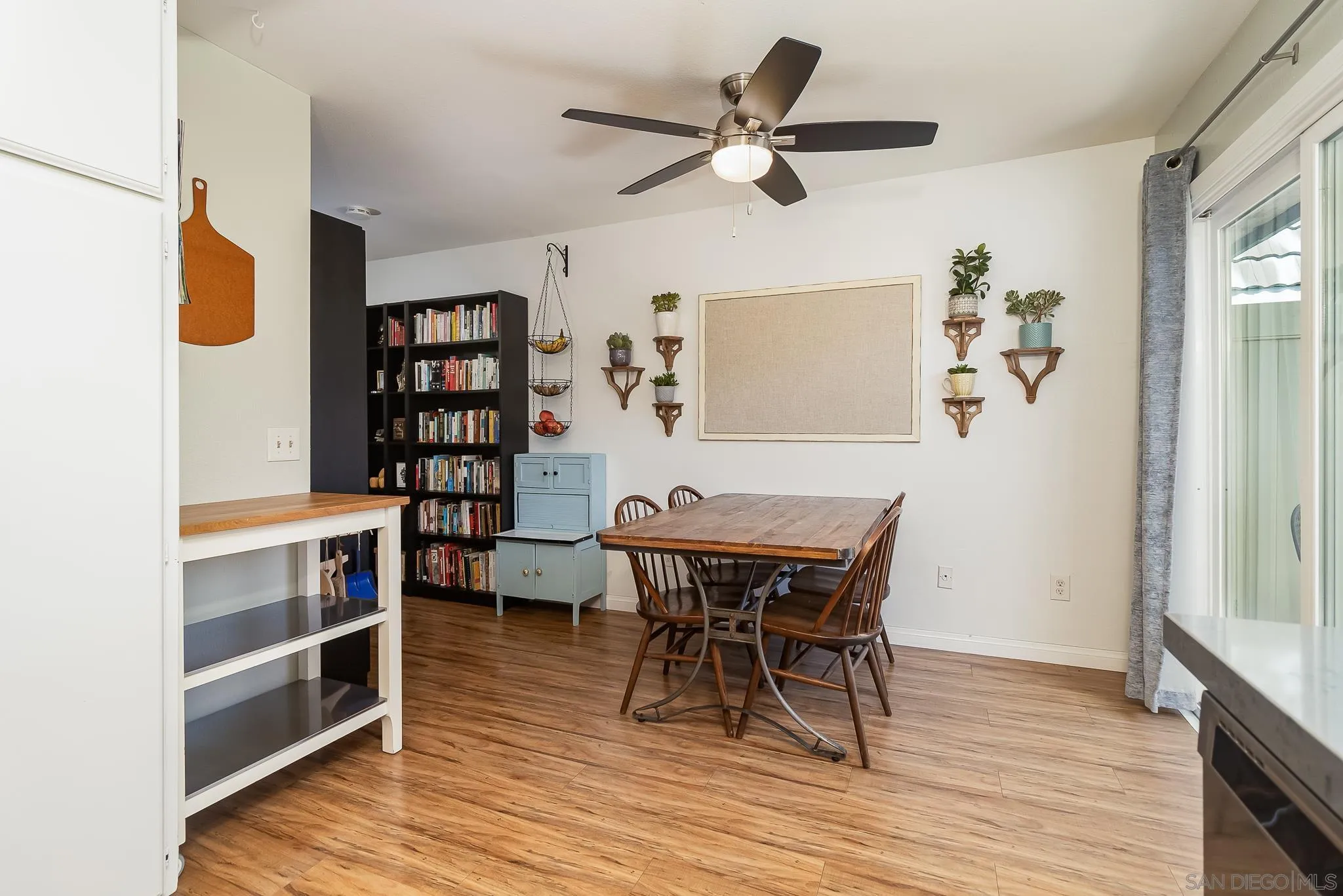 350 G Street, Unit E2 Chula Vista, CA 91910 - Photo 6 of 30 a view of a workspace with furniture and wooden floor